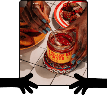 Hands holding a bowl of Kwikish Jollof Rice