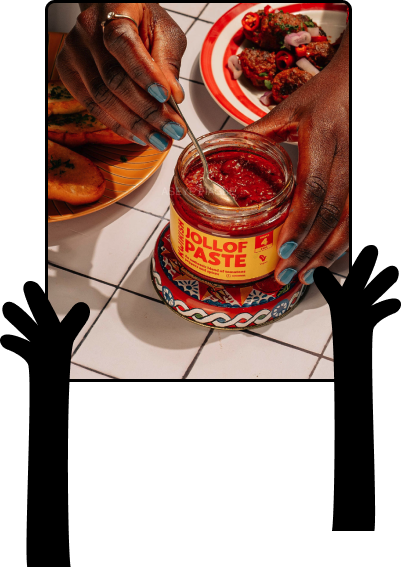 Hands holding a bowl of Kwikish Jollof Rice